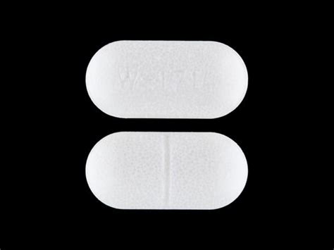 xp; ur; qt. . White oval pill with line down the middle on one side